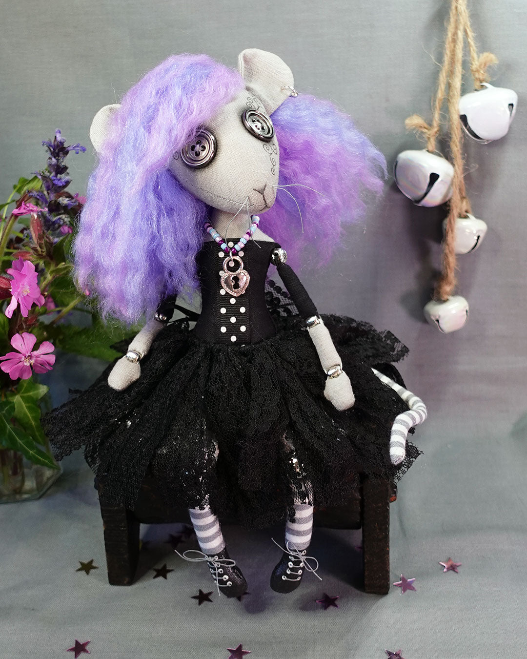 a goth rat girl art doll with button eyes, whiskers, pastel hair, black dress with tattered lace skirt, and lace up boots