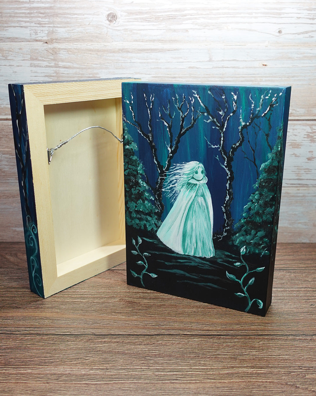 spooky gothic ghost paintings showing hanging wire and D ring fittings on back