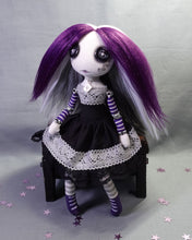 a button eyed, cloth art doll in Ace flag colours, black, grey, white and purple