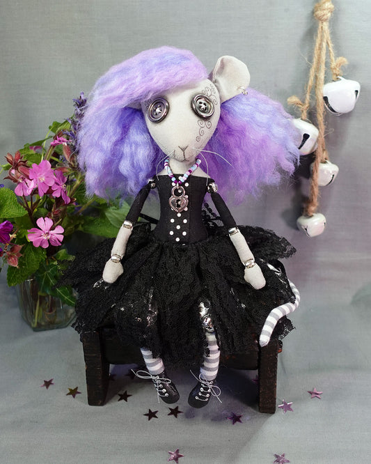 a goth rat girl art doll with button eyes, pastel hair, black dress with tattered lace skirt, and lace up boots