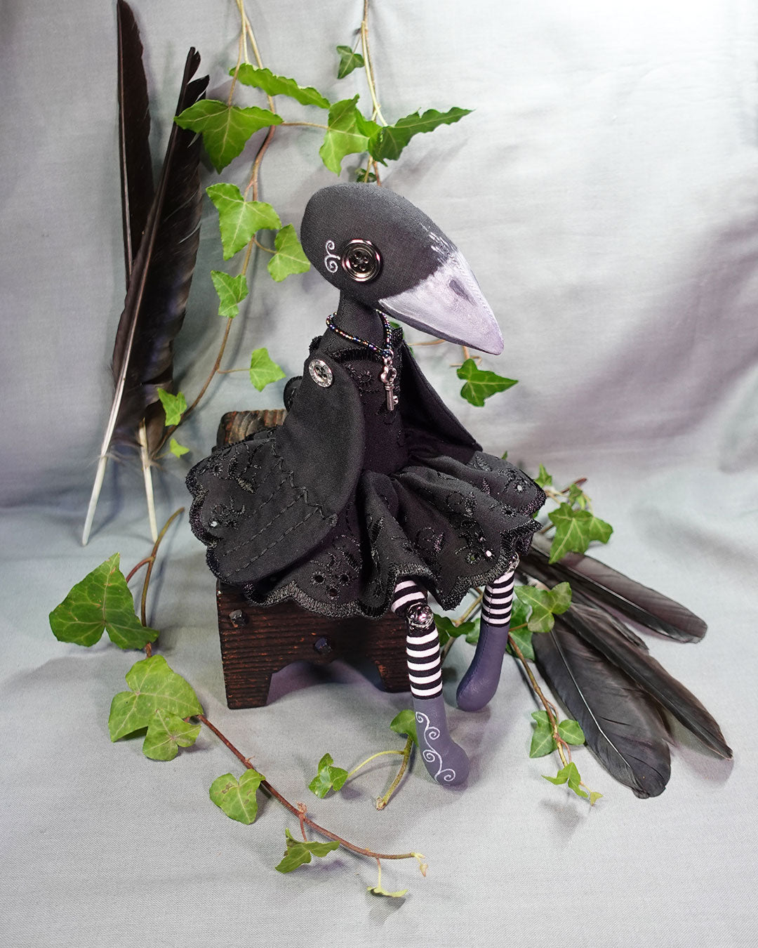 button eyed black crow doll with decorative painted detail