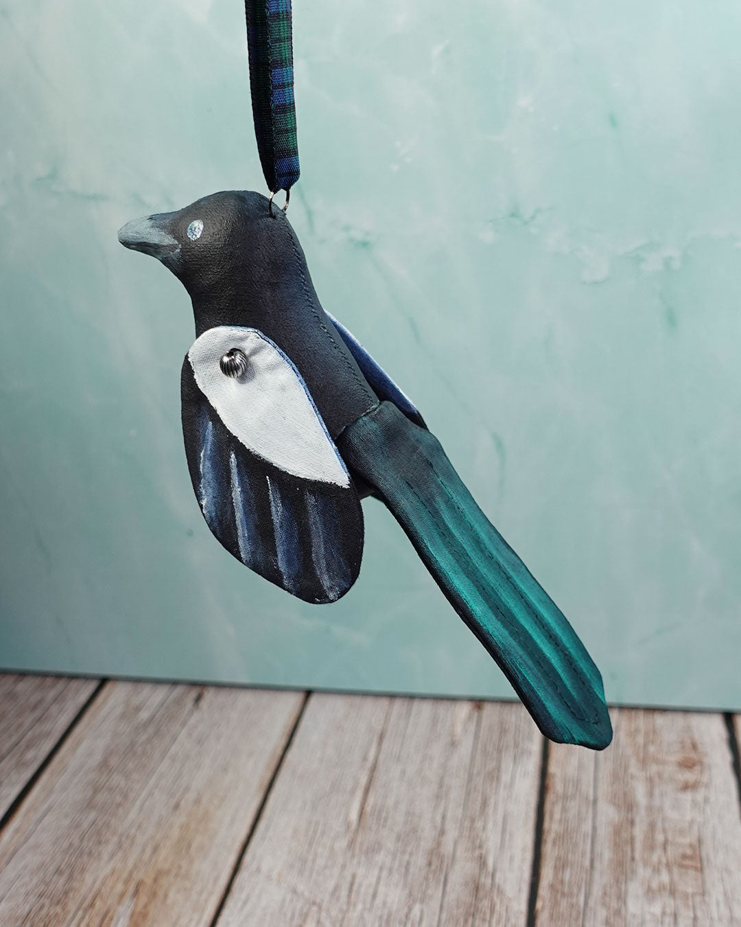 magpie bird ornament on hanging ribbon
