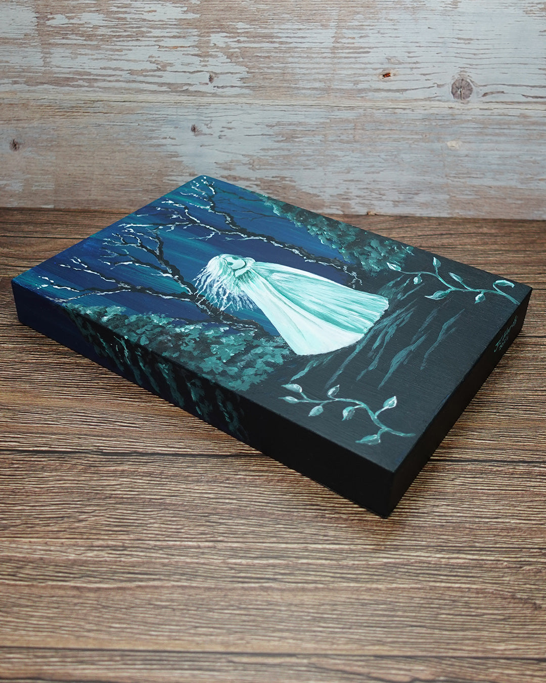 painting of a ghost in long cloak in spooky forest setting, on deep edge wooden panel