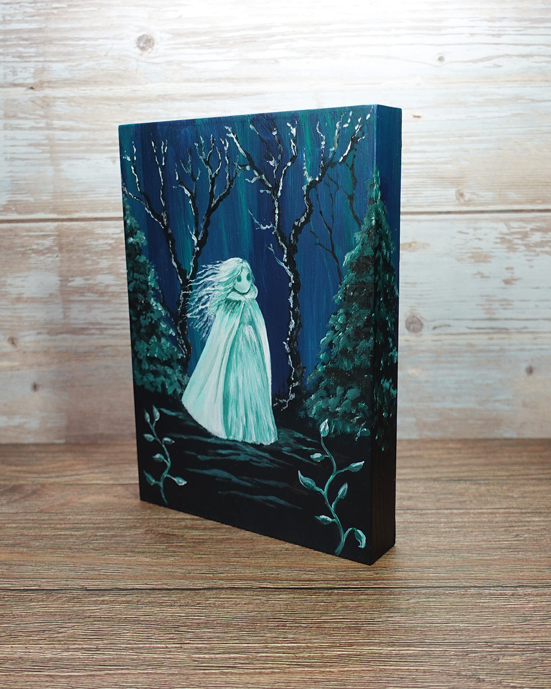 painting of a ghost in long cloak in spooky forest setting, on deep edge wooden panel.