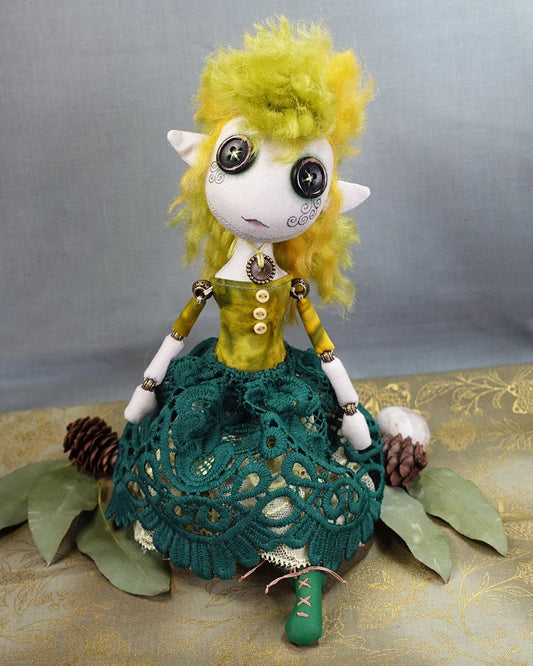 a button eyed welsh fairy art doll in green and yellow