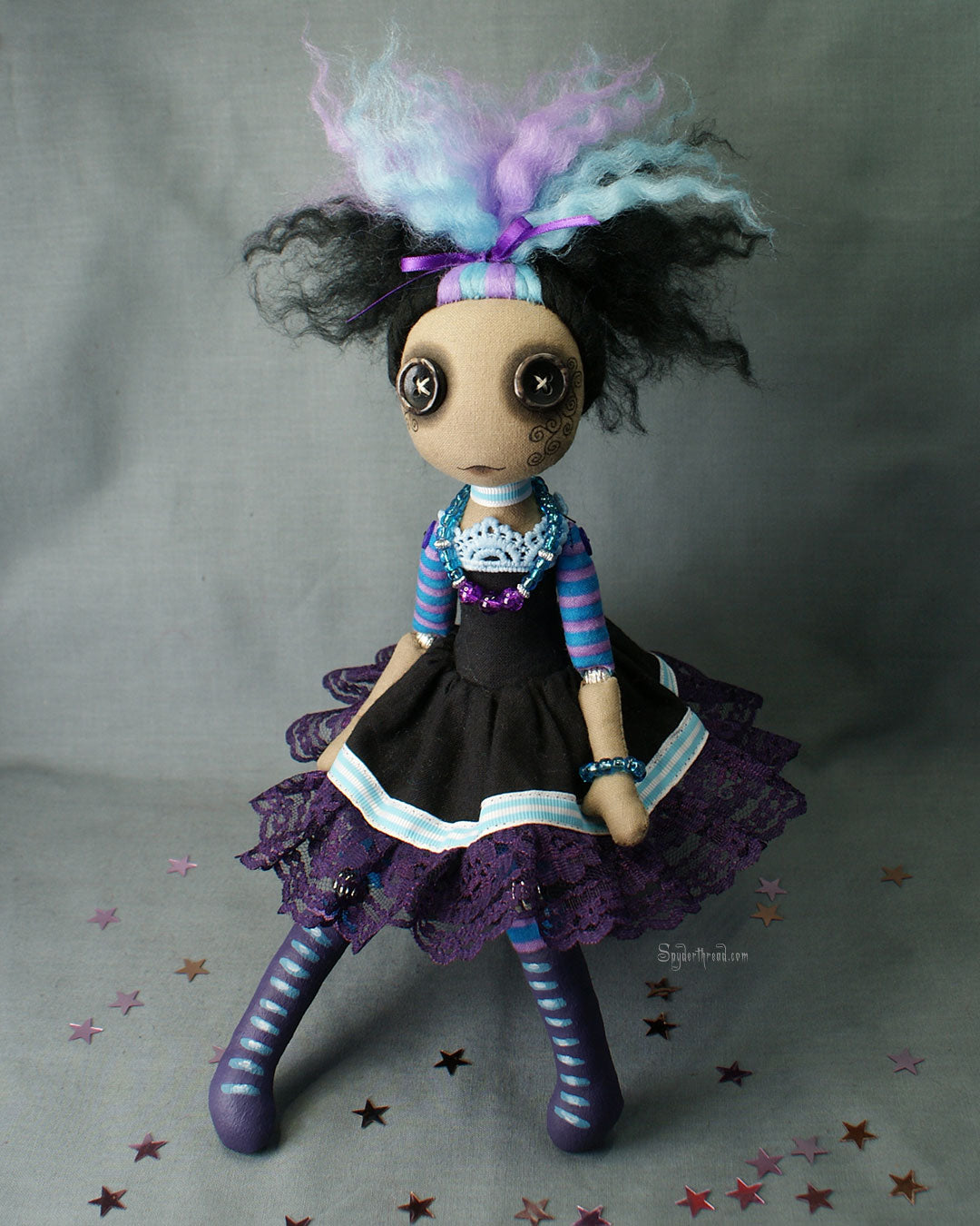 BAME brown skin tone button eyed Gothic style doll in black purple and blue dress with purple lace up boots